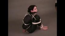 4 short videos in one of an beautiful black haired archive girl tied and gagged on the floor wearing sexy shiny nylon rainwear (Video)