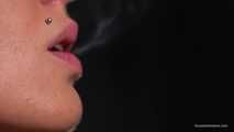 Smoking 100mm Marlboro Red in this closeup video 