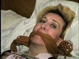 44 Yr OLD HOUSEKEEPER IS 44 Yr OLD HOUSEKEEPER IS BANDANA CLEAVE GAGGED, BALL-TIED & HANDGAGGED ON THE BED (D53-4)