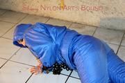 Jill tied, gagged anmd hooded with old handcuffs lying in an old cellar wearing a sexy lightblue skibib (Pics)