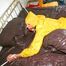 Stella tied and gagged on a bed wearing a supersexy yellow rainwear combination (Pics)