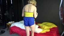 *** Sexy MIA wearing a blue shiny nylon shorts and a yellow top during changing the cloths on her bed  (Video)***