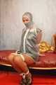 Miss Scarlett bound and gagged in full PVC outfit and transparent raincoat