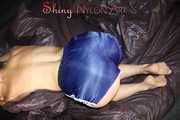 Sexy SANDRA wearing only a very hot blue shiny nylon shorts playing with a bed cloth and posing on a sofa (Pics)