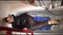 Watching Sandra wearing sexy shiny downwear taking a bath (Video)