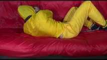 ***MARA*** ties and gagges with cuffs on the sofa wearing a supersexy oldschool yellow rain suit with hood (Video)