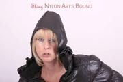 Pia tied, gagged and hooded in bed wearing a shiny black rain pants a a shiny black downjacket (Pics)