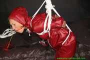 Watch Sandra bound gagged and Pantyhooded wearing her shiny nylon Rainwear