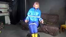 Sexy Pia being tied and gagged with ropes and a cloth gag on a hairdressers chair wearing a sexy blue shiny nylon rainpants and a lightblue downjacket (Video)