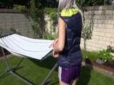 Watch Chloe enjoying her shiny nylon Downwear outside at a sunny Day