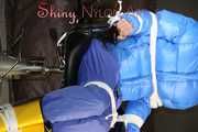 Sexy Pia being tied and gagged with ropes and a cloth gag on a hairdressers chair wearing a sexy blue shiny nylon rainpants and a lightblue downjacket (Pics)