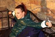 Mara tied and gagged on a princess bed in an old cellar wearing an supersexy shiny green down jacket and a rain pants (Pics)