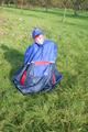 Jill wearing supersexy shiny nylon rainwear and a rain cape posing outdoor in the field (Pics)