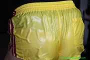 Watch Pia in her special yellow shiny nylon Shorts