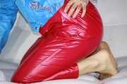 Watching sexy Sandra putting on a very special red shiny nylon pant posing and lolling for you (Pics)