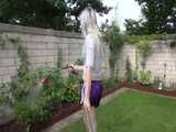 Get a video with Chloe enjoying gardening in her shiny nylon Shorts