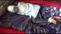 Lulu tied and gagged on a bed wearing a sexy blue shiny nylon rainpants and a iceblue PAMY downjacket (Video)