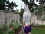 Get a video with Chloe enjoying gardening in her shiny nylon Shorts