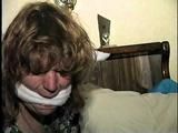 28 YEAR OLD HOUSEWIFE IS BALL-GAGGED, CLEAVE GAGGED, HANDGAGGED, HANDCUFFED & TIED UP ON THE BED (D63-8)