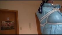 Lucy tied and gagged on a stairway wearing an iceblue down jacket and a new very thin and comfortable adidas pant (Video)