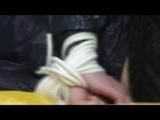 Samantha tied and gagged on a sofa wearing a shiny black nylon shorts and a shiny rain jacket (Video)