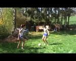 Jill and a friend of her playing soccer in the garden while wearing shiny nylon shorts (Video)