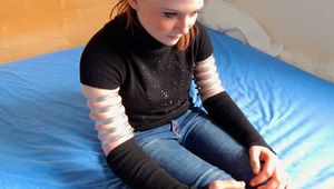Lea wearing five very tight hose clamps on each arm