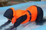 Watching sexy Sonja wearing a sexy shiny nylon rain pant and rain jacket as well as a lifevest enjoying the water in the swimming pool (Pics)