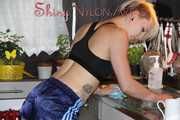 Watching sexy COURTNEY wearing a darkblue shiny nylon shorts and a top while preparing coffee and doing her housework (Pics)