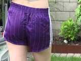 Get a video with Chloe enjoying gardening in her shiny nylon Shorts