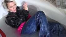 SEXY SONJA wearing a sexy shiny nylon rainwear combination having fun in the bathtub and in the shower (Video)