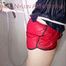 Jill tied and gagged on a shower with cuffs wearing a sexy red shiny nylon shorts and a black rain jacket (Pics)