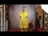 Miss Scarlett in layers of nylon raingear, a friesennerz and hard bound and gagged