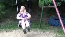 Miri cuffed on a swing