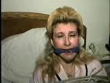 44 Yr OLD HOUSEKEEPER IS 44 Yr OLD HOUSEKEEPER IS BANDANA CLEAVE GAGGED, BALL-TIED & HANDGAGGED ON THE BED (D53-4)