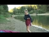 Jenny bathing in a lake and sun bathing wearing sexy red shiny nylon shorts and a rain jacket (Video)