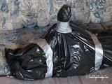 [From archive] Veronika - captured, hogtied and packed into trash bag 02