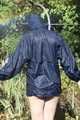SEXY MARA wearing only a darkblue rain jacket and rubber boots while examining the garden and being sprinkled with water out of the garden hose (Pics)