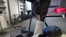 Watch Sandra cleaning the Studio wearing shiny nylon Rainwear and white Rubberboots