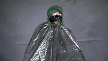 Marie M. taped and gagged in shiny nylon rainwear