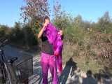 Watch Sandra riding her Bike in her sexy pink shiny nylon Rainsuit