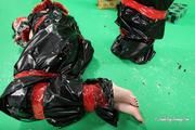 [From archive] Masha More and Malika - packed in trash bags with red duct tape like New Year presents 02