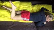 Sexy Sandra preparing her bed with yellow shiny nylon cloth wearing a sey red shiny nylon shorts and a black tshirt (Video)