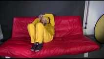 ***MARA*** ties and gagges with cuffs on the sofa wearing a supersexy oldschool yellow rain suit with hood (Video)