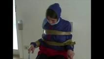 3sets of short videos with Katharina tied and gagged and hooded on a chair wearing shiny nylon rainwear (Video)