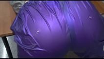 Jill tied and gagged on a table wearing a shiny purple/silver PVC sauna Suit (Video)