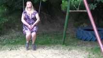 Miri cuffed on a swing