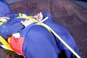 ***HOT HOT HOT*** SANDRA tied with ropes on the floor, gagged with a cloth gag wearing a sexy blue oldschool shiny nylon down suit (Pics)