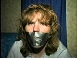 28 YEAR OLD HOUSEWIFE GETS MOUTH STUFFED, ACE BANDAGE , DUCT TAPE, & BALL-GAGGED WHILE BALL-TIED BAREFOOT ON FLOOR (D54-16)