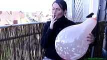 enjoying cigarette with a tight balloon